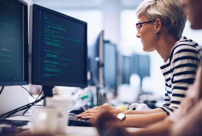 photo of a woman working on a computer